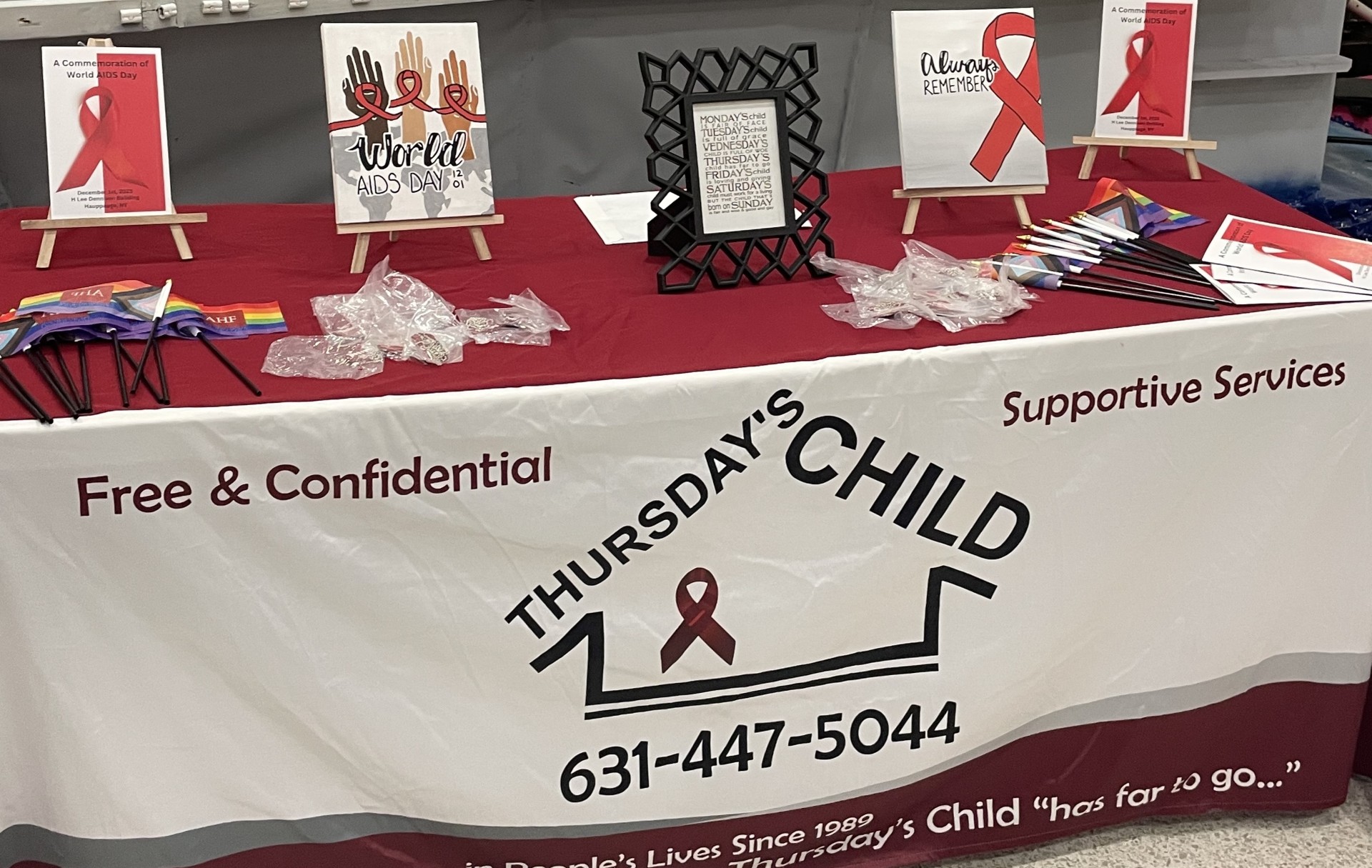 Thursday's Child outreach table with supportive services and LGBTQ+ health resources
